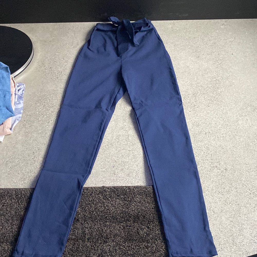 Blue Trouser Dress Pants with Bow Tie in front and Zipper in back. Size Small.